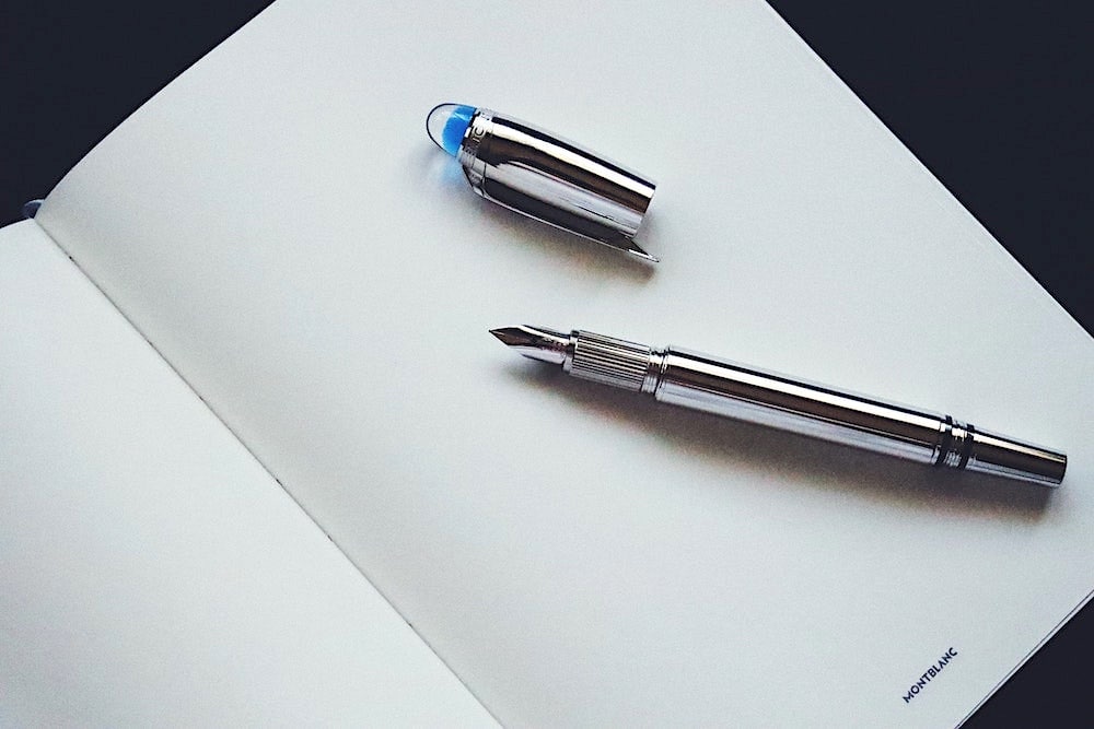 Photo of Montblanc StarWalker pen on a writing tablet. Photo by Omar Al-Ghosson.